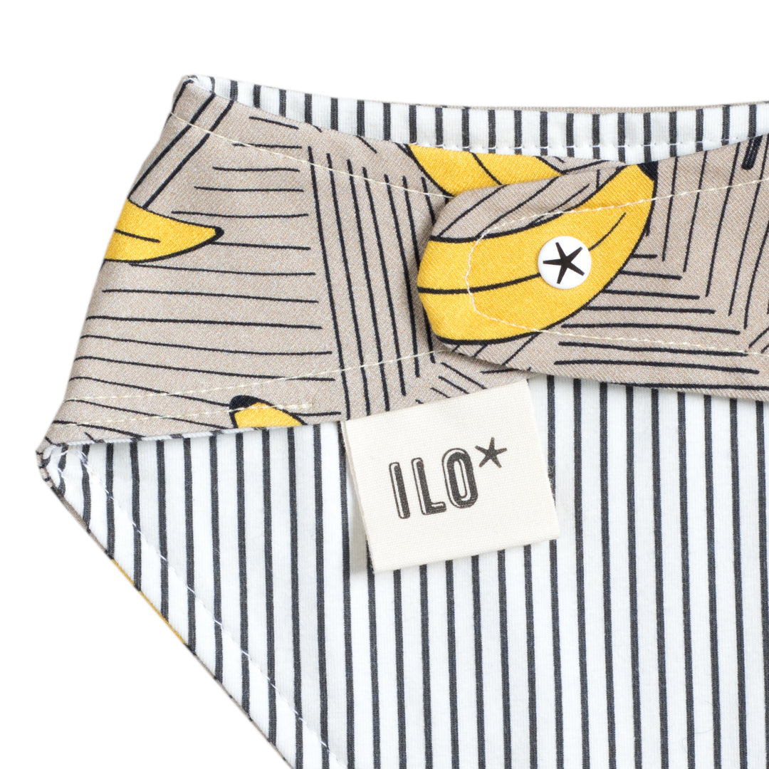 close up of the beige bananas bib