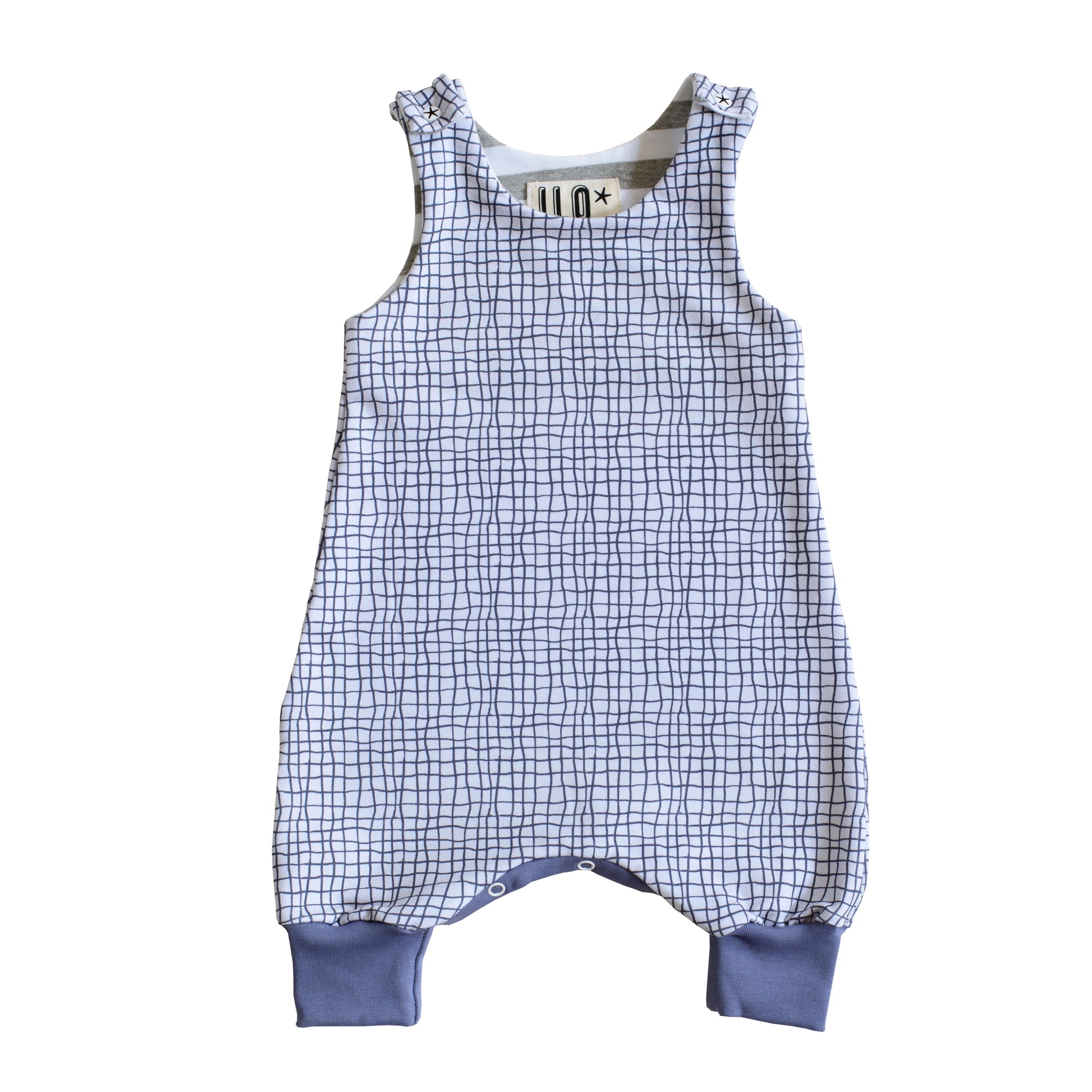 ILO grow with me romper in a black and white grid with dusty blue cuffs