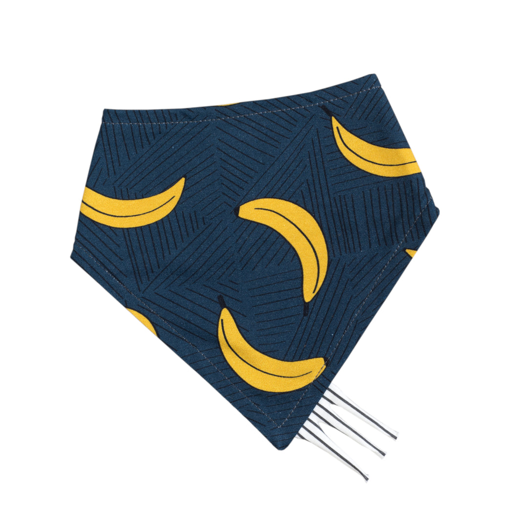 Bandana style taggy dribble bib on navy colour organic cotton jersey with bananas print