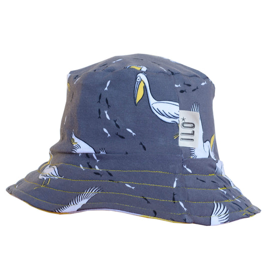 Organic reversible bucket sun hat with pelicans on grey, stripy fabric on reverse