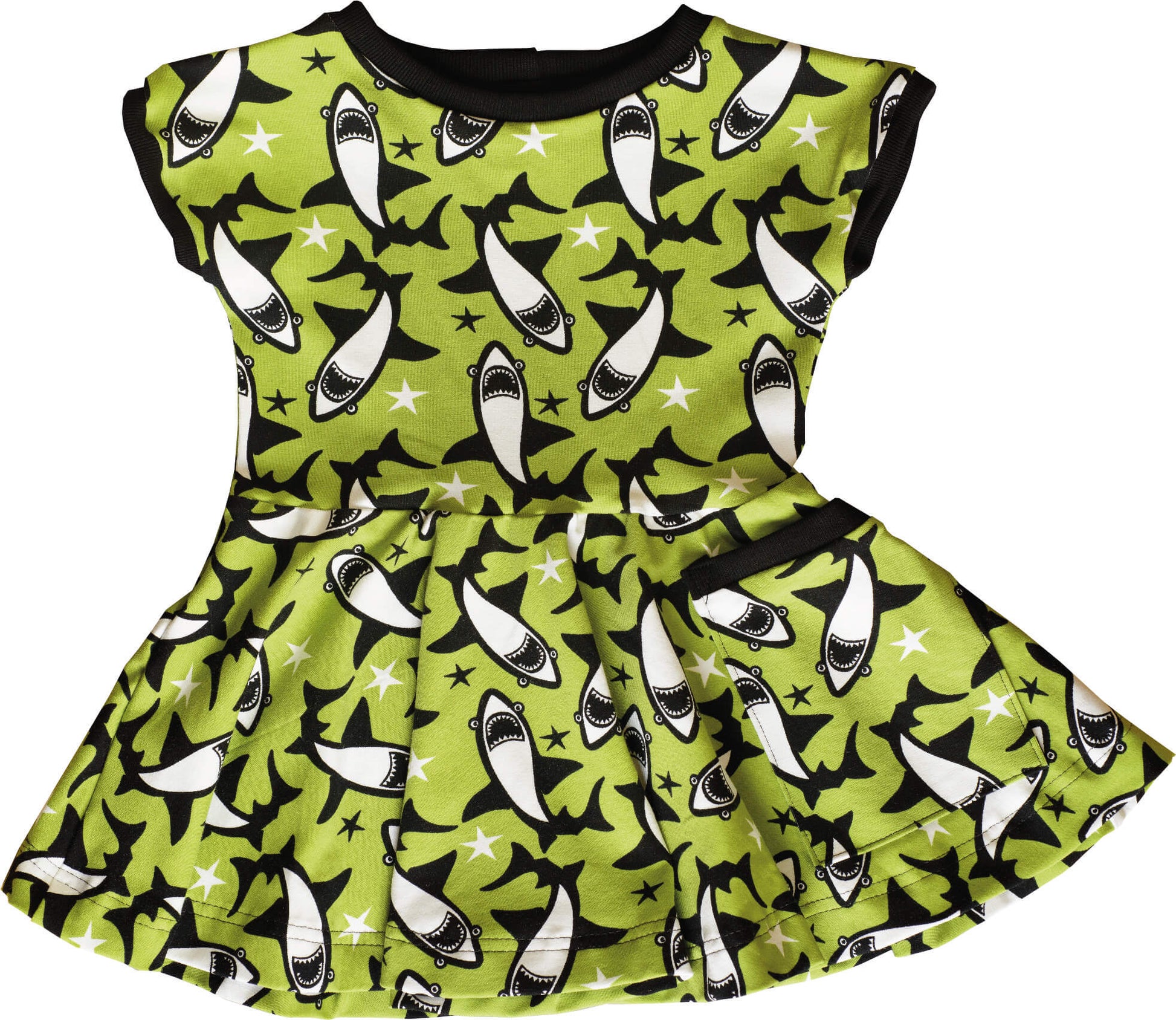 skater dress for baby and kids in a green with sharks print. Flowy skirt and pocket included.
